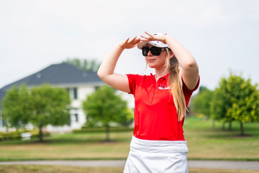 golfer watching their hit at the Cardinal Legacy Golf Outing
